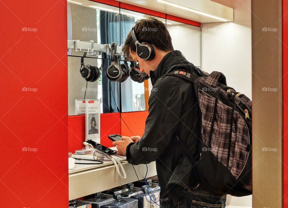 Hipster Checking Out Headphones