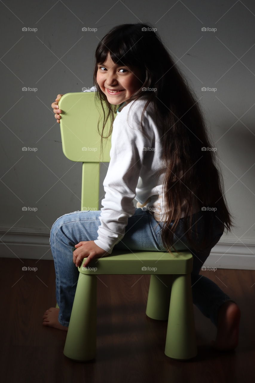 Cute little girl with a long hair, portrait