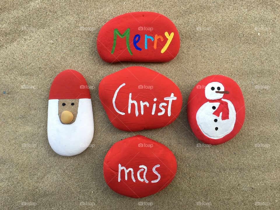 Merry Christmas on red stones 