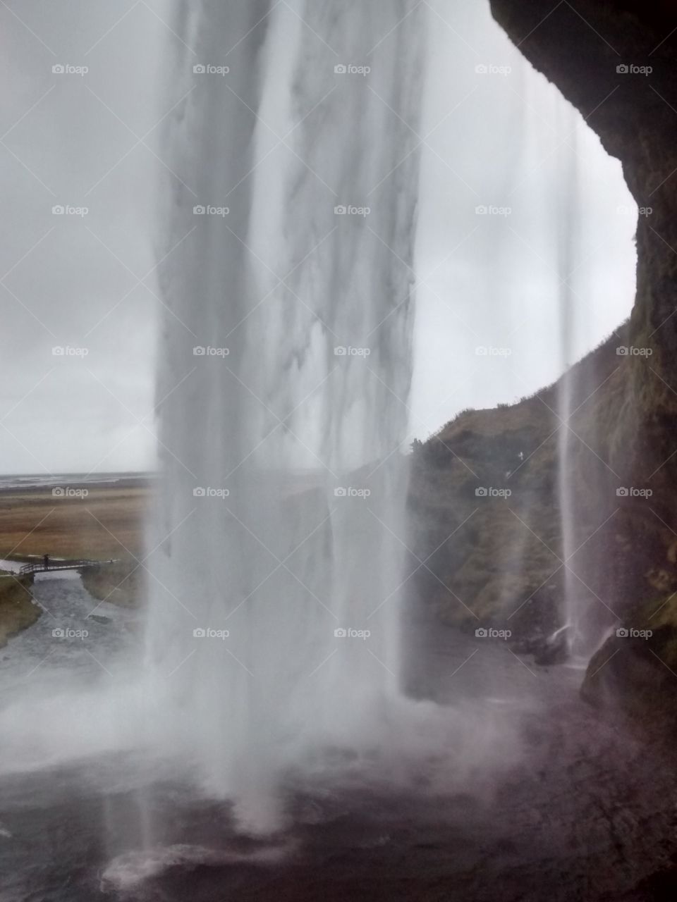 One of Iceland's largest waterfalls pictured from behind the fall.