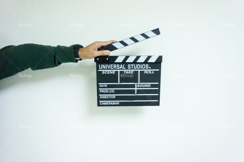 Man and clapper board for making video cinema in studio.Movie production clapper board or slate film concept.