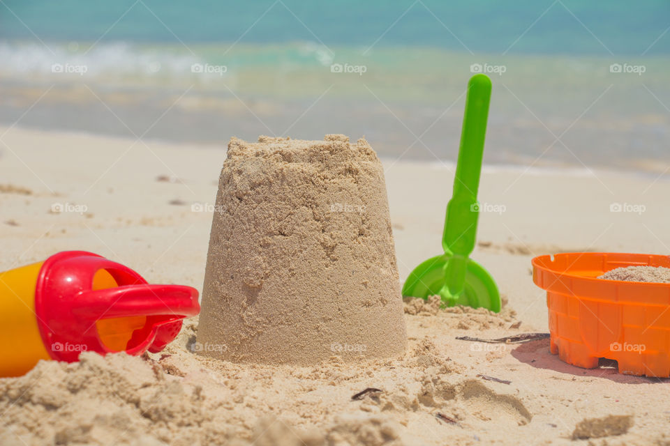 Playing with sand by the beach