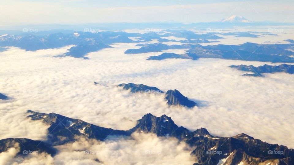 Aerial view of clouds over the mountains