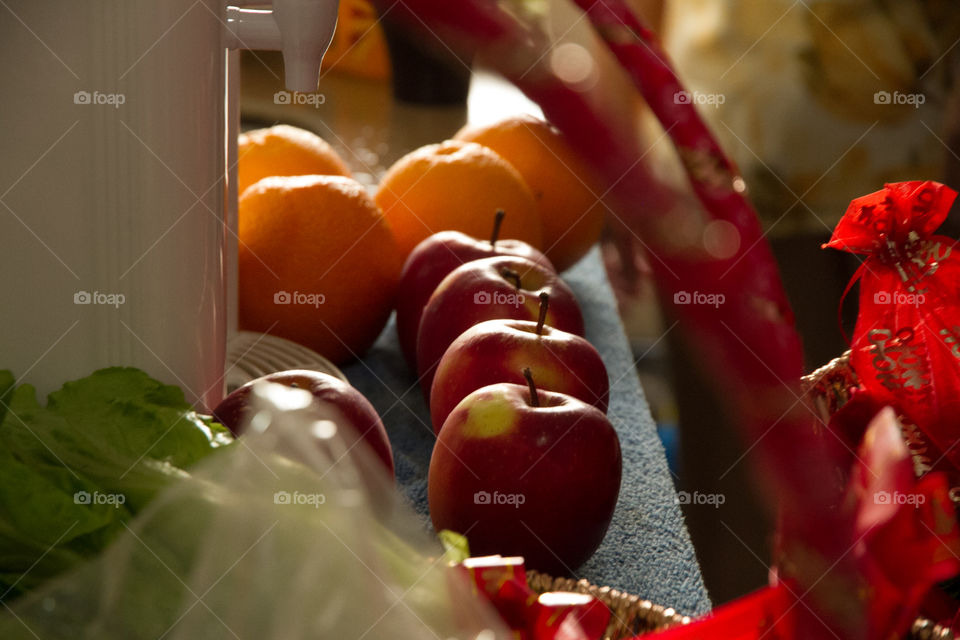 Apples and oranges on table