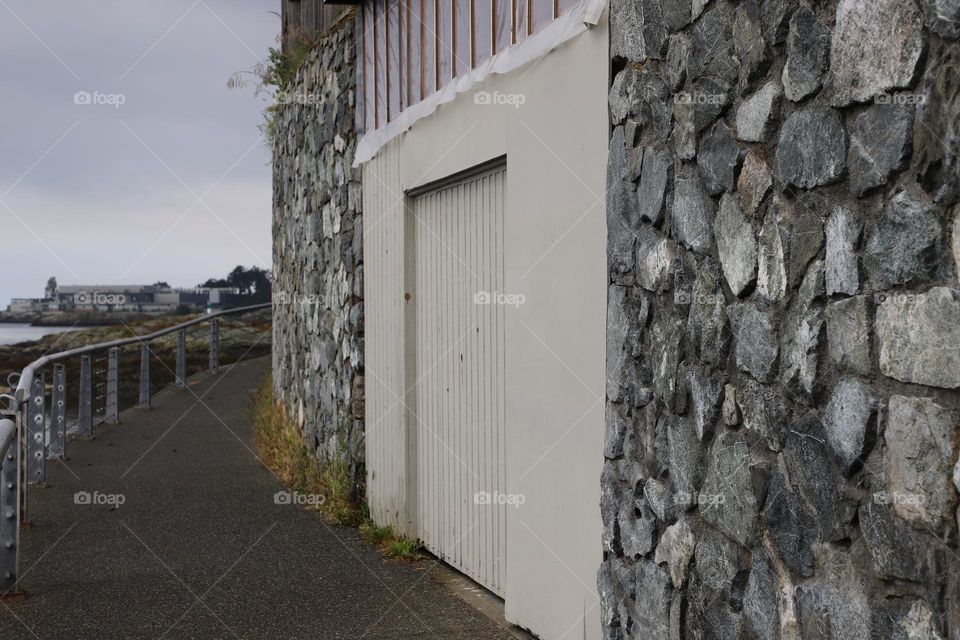 Rocky house with white door 