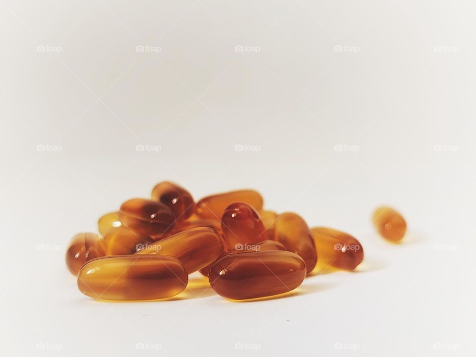 soft gelatin capsules on white isolated background