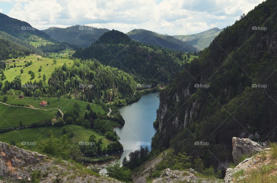 A beautiful view from the top. River running through the mountain. Hiking with friends.