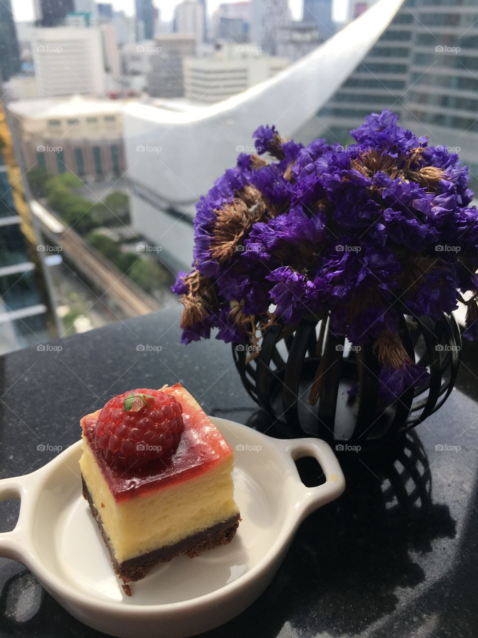 Raspberry cake on the white dish.