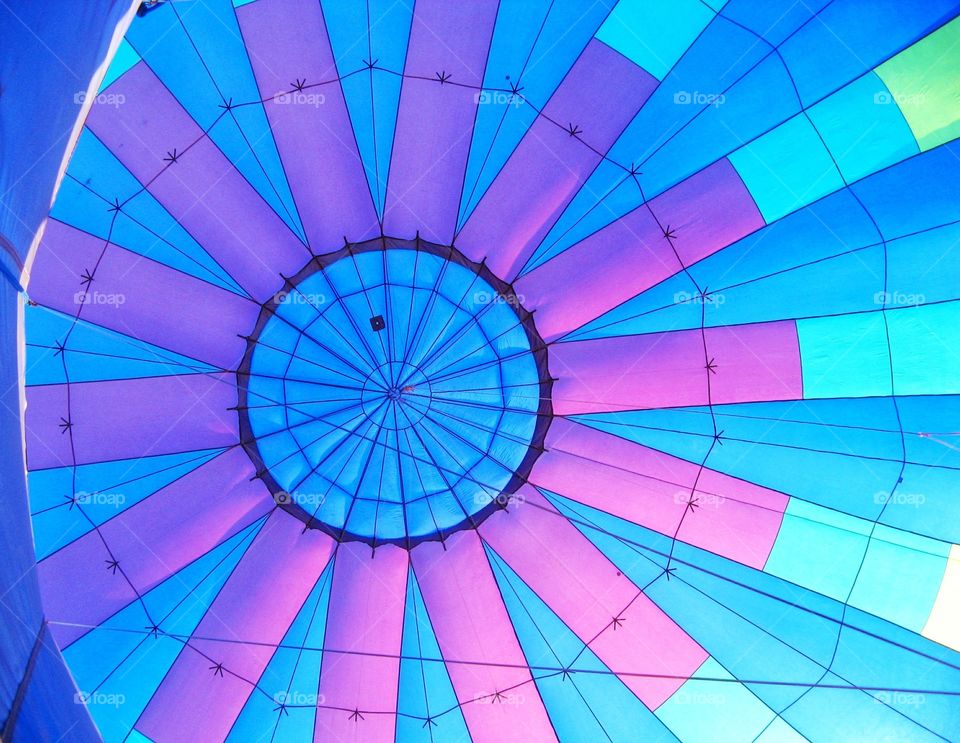 Inside a big, beautiful and colorful hot air balloon.