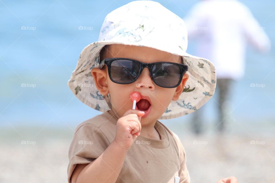 Cute baby boy with a lolipop