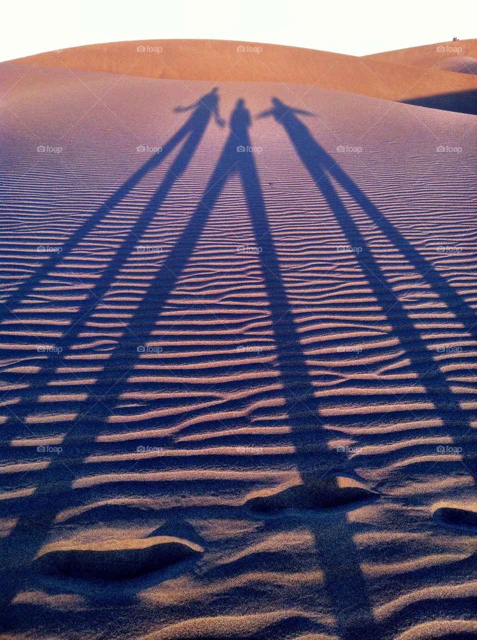 people sunset shadows sand by rebelf