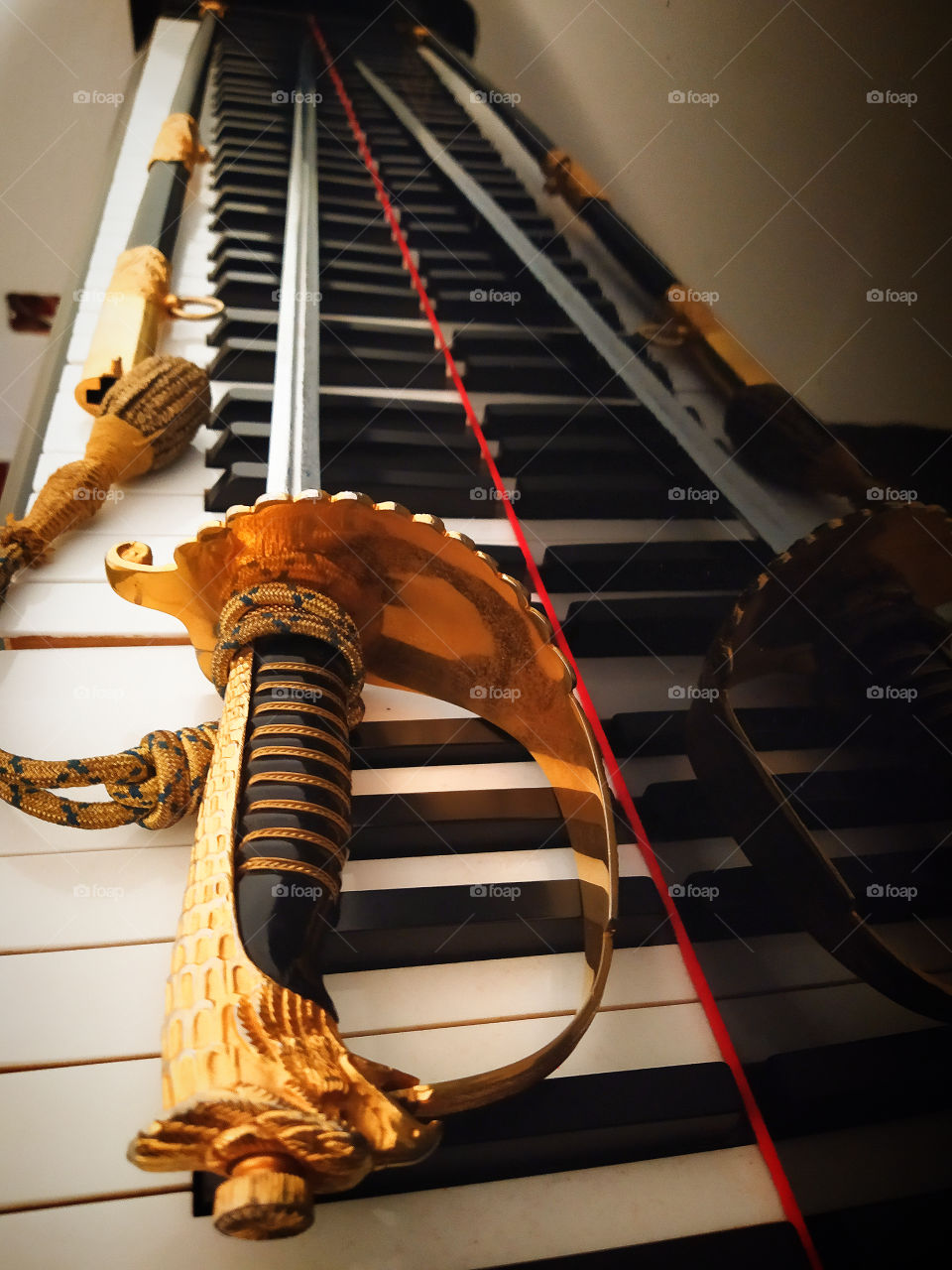 Officer's sword on the piano key