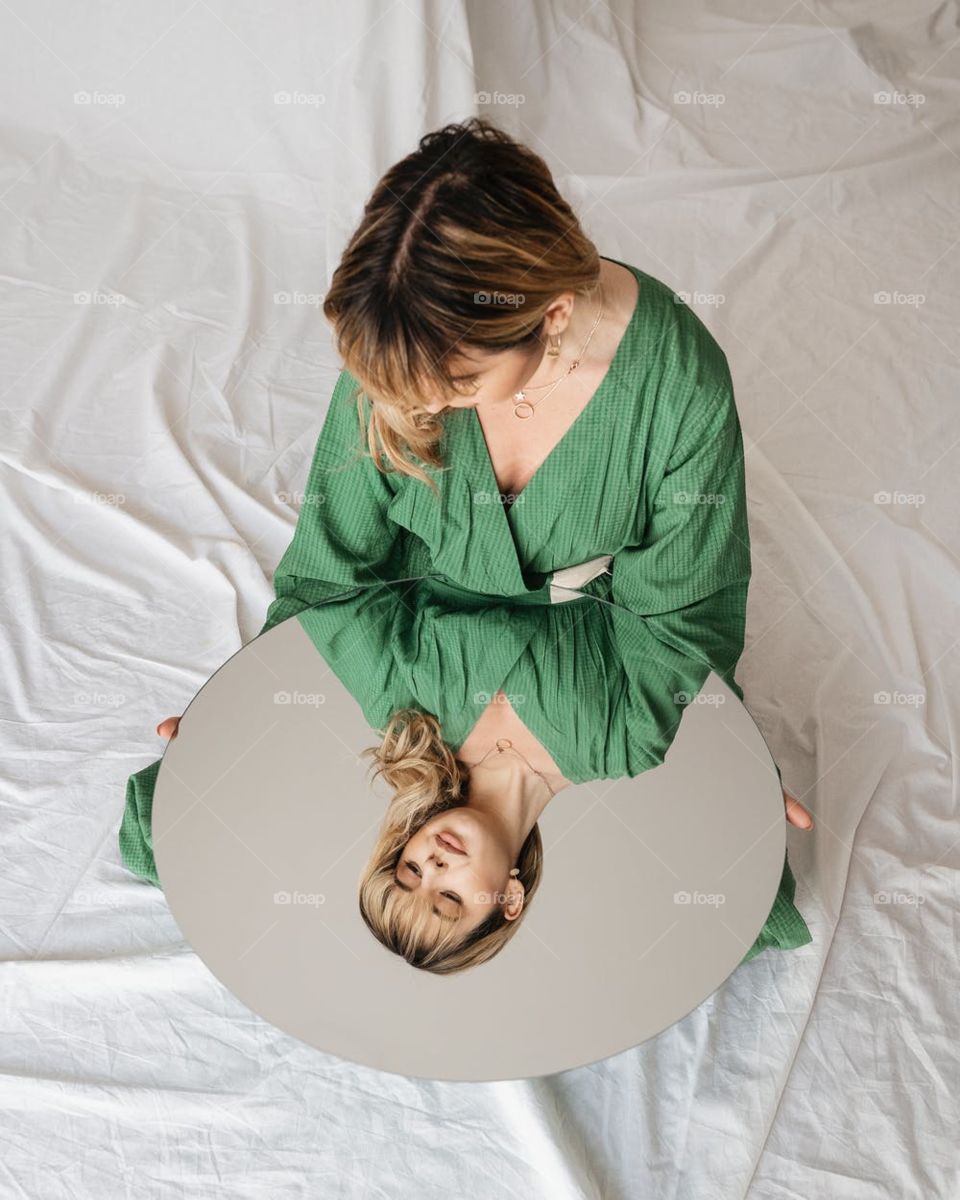 I would like describe this photo beautiful face on the mirror and luxurious smiling