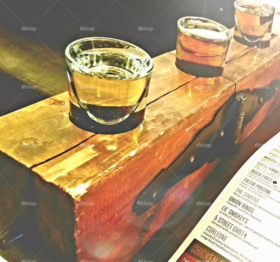 Fly away on this rustic wooden flight with golden amber hued whiskeys for sipping when you cant decide on the perfect cocktail.
