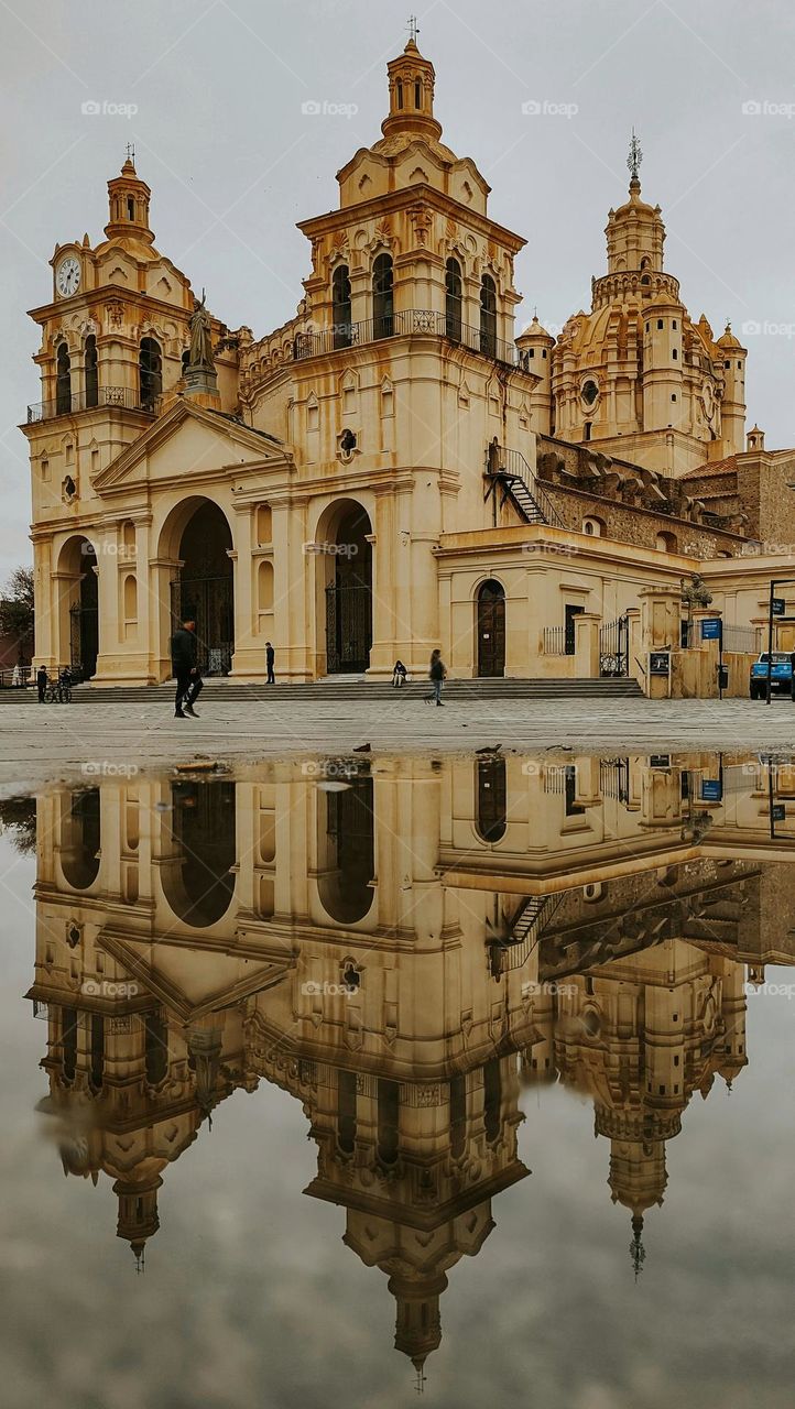 Photo of the Cathedral of Our Lady of the Assumption, located in Córdoba Capital, Argentina. Photo of reflection in water.