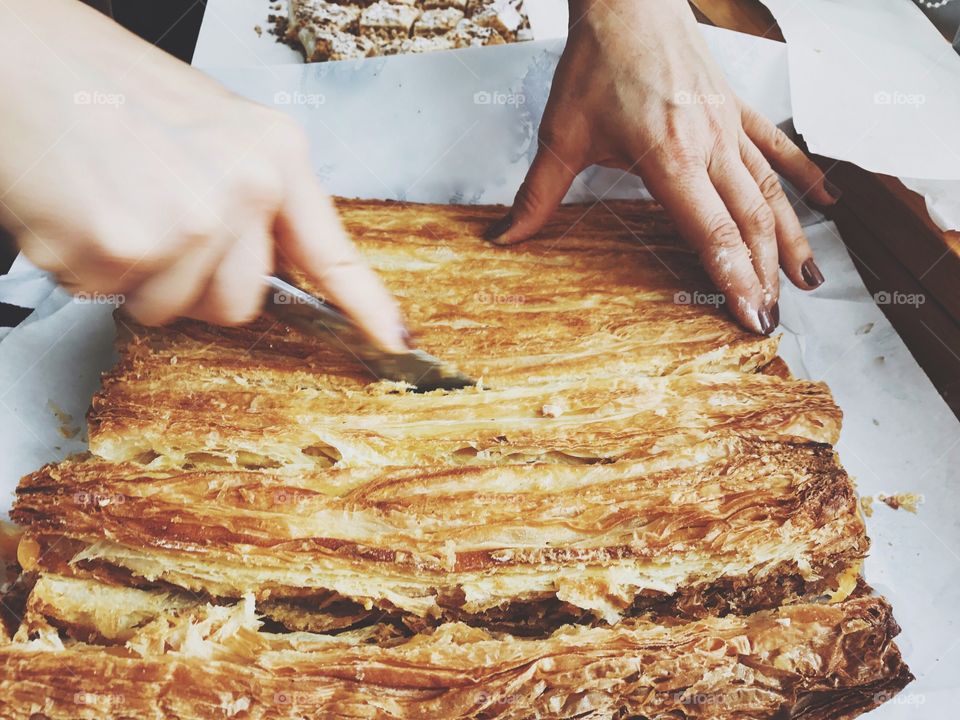 Woman cutting puff pastry