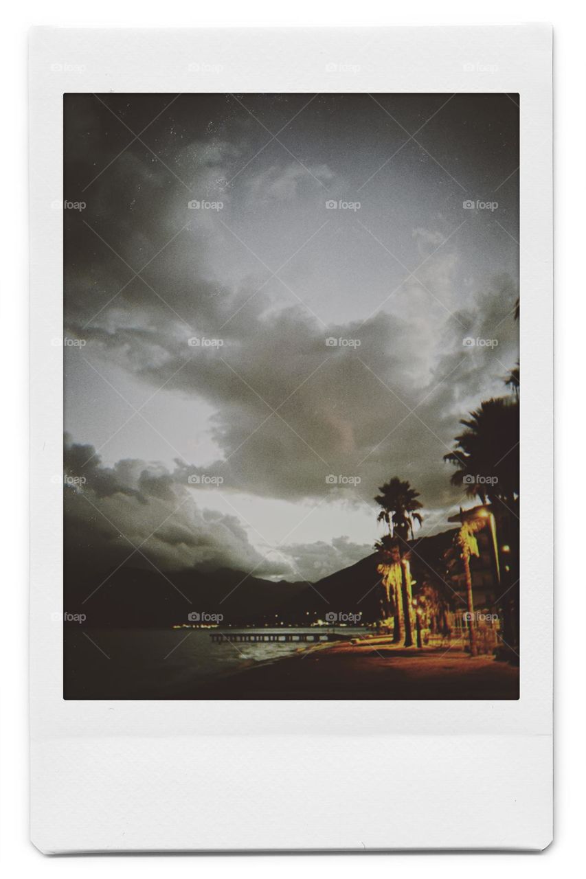 Polaroid photo rain on the beach at night view