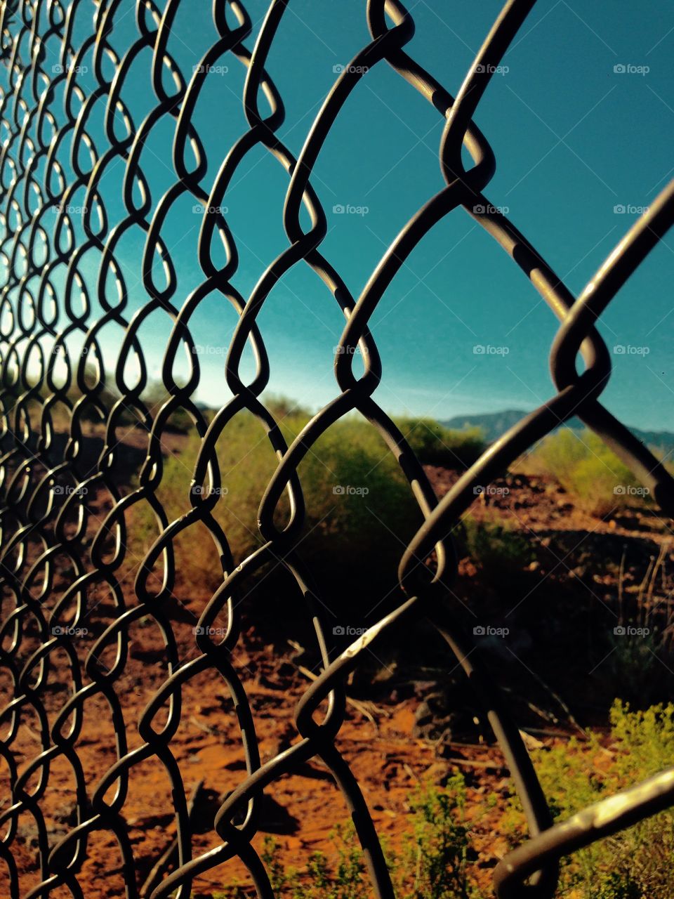 Gated Desert. Photo shot of an old fence gating off the desert 