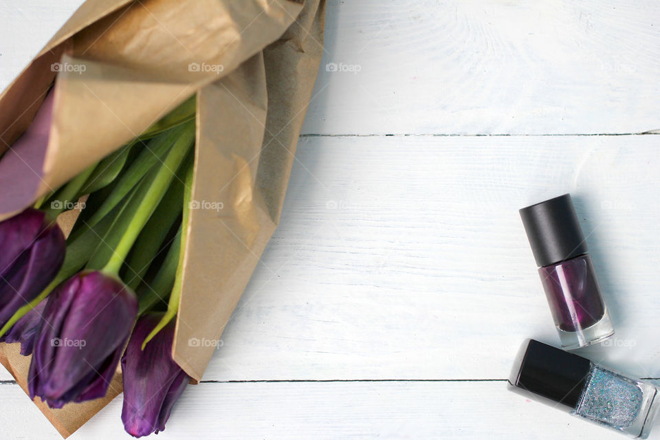 A bouquet of tulips and purple nail polish: congratulations, March 8 (International Women's Day), February 14th (Valentine's Day), holiday, decoration