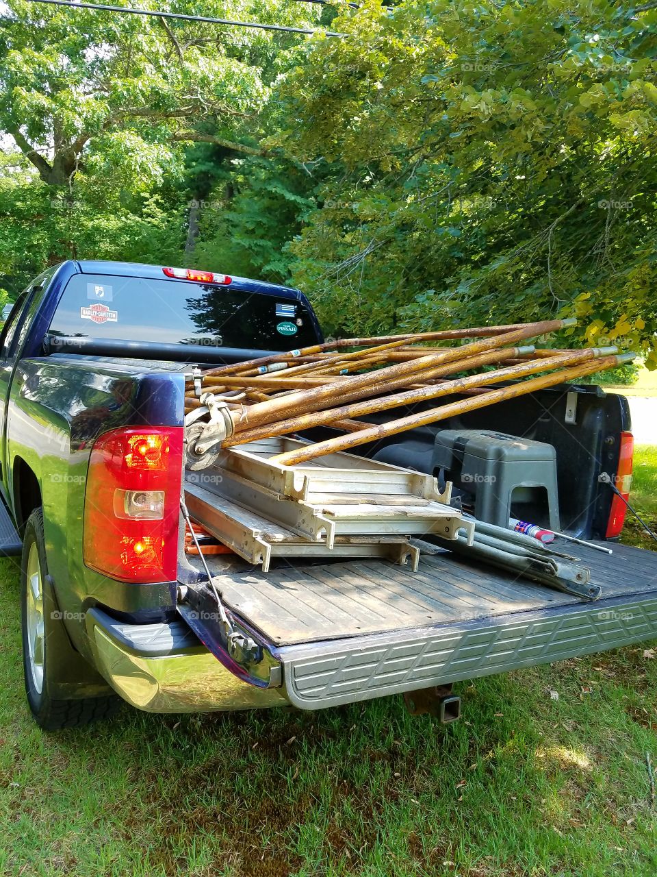 Construction Staging in back of pick up truck, transporting.
