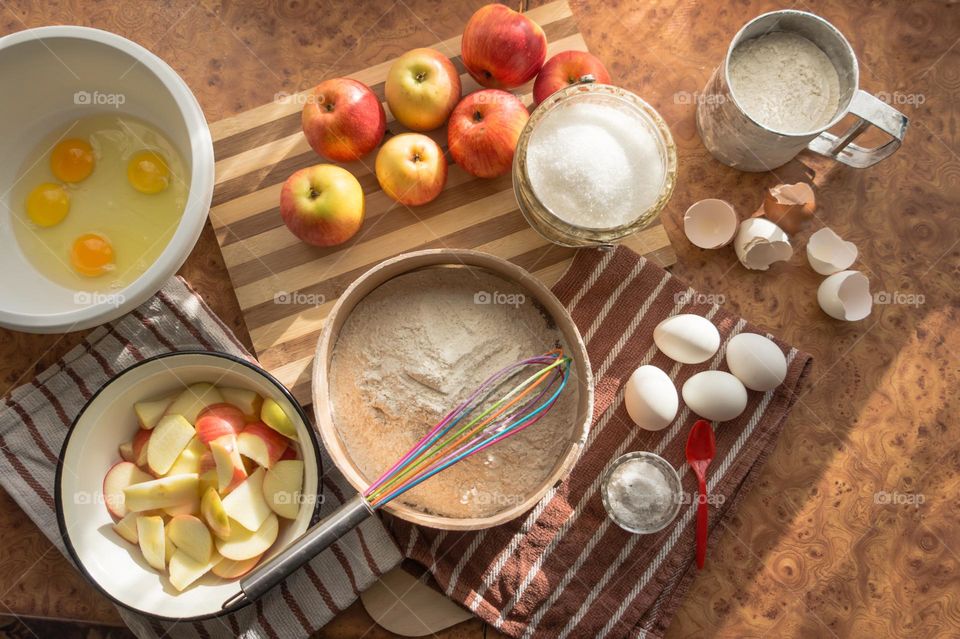 Making homemade puffed apple pie with eggs, sugar and flour.