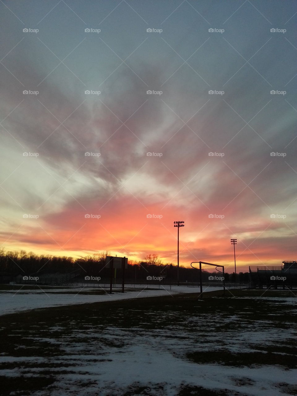 Sunset over football field