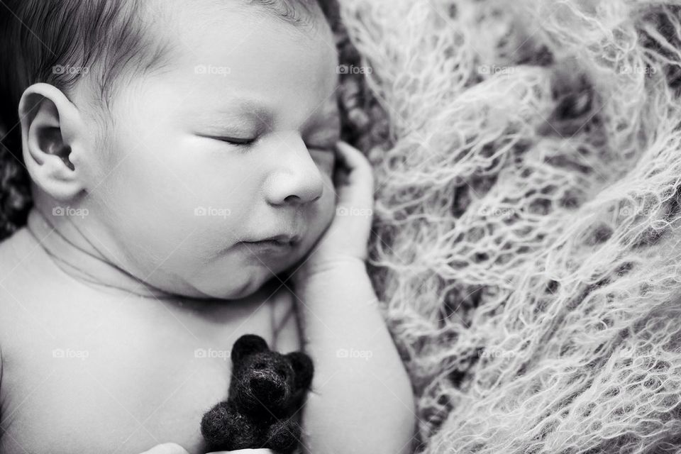 Cute infant with toy