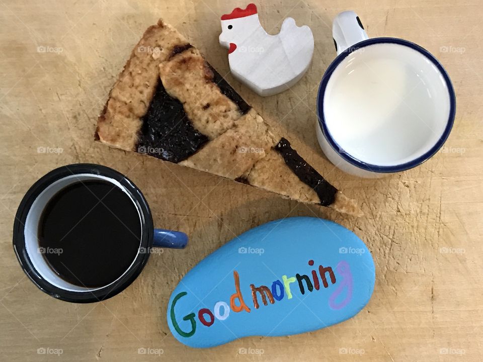 Home breakfast with a wooden chicken toy