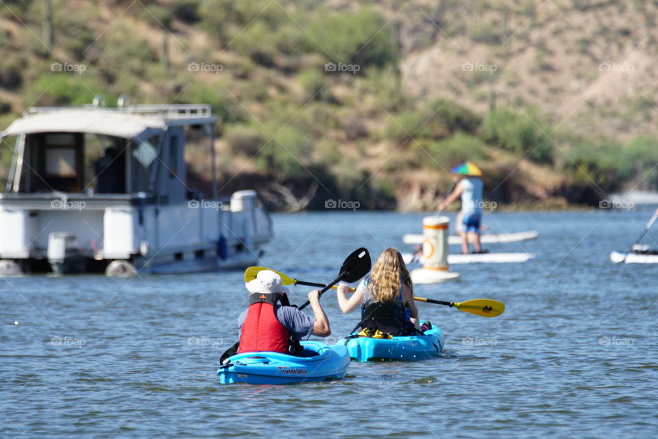 Kayakers enjoy a beautiful summer day in Arizona on Saguaro Lake