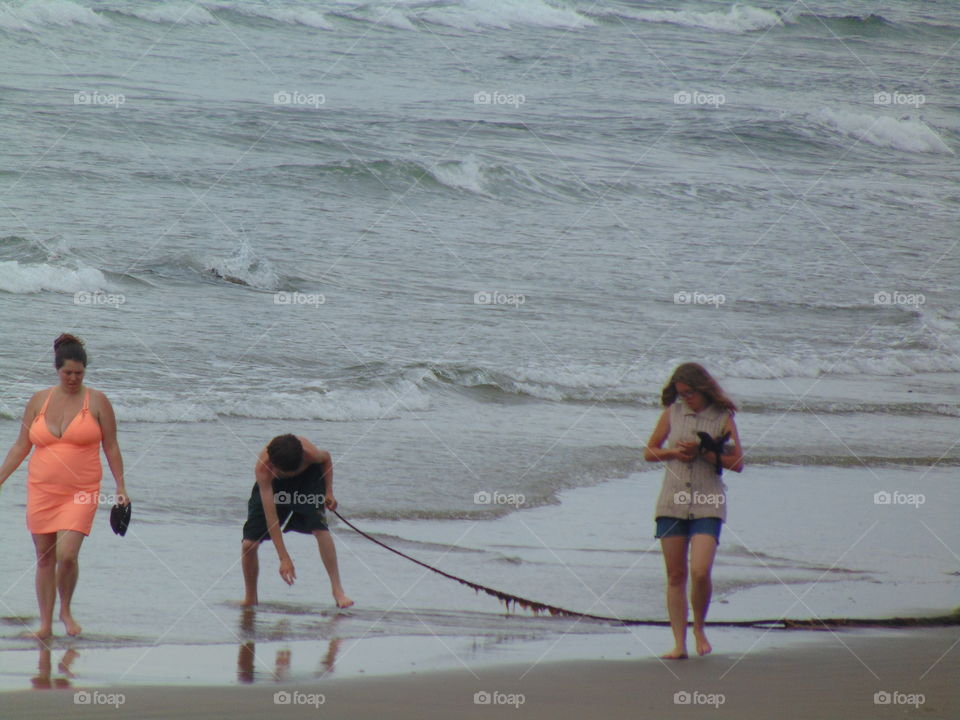 family time beach ocean sand seaweed