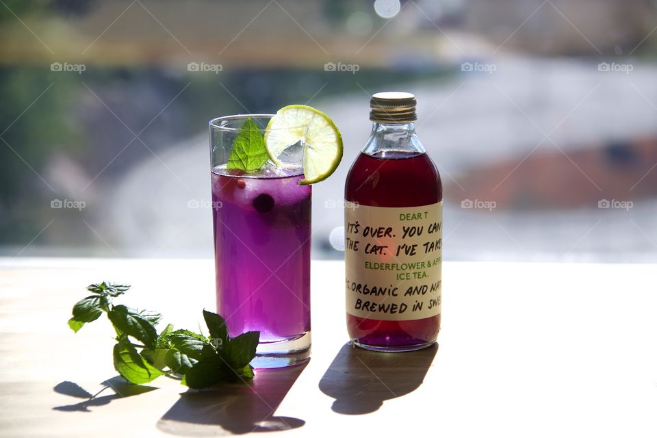 Summer juice with taste of elderberry juice, strawberries and butterfly pea flower tea 