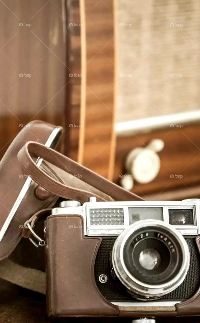 nice brown colour old camare with white flesh old is gold image so vintage camera