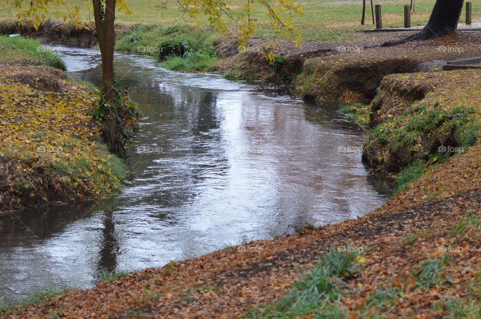 local Creek reaching close to the flood level on a rainy day in Citrus Heights California