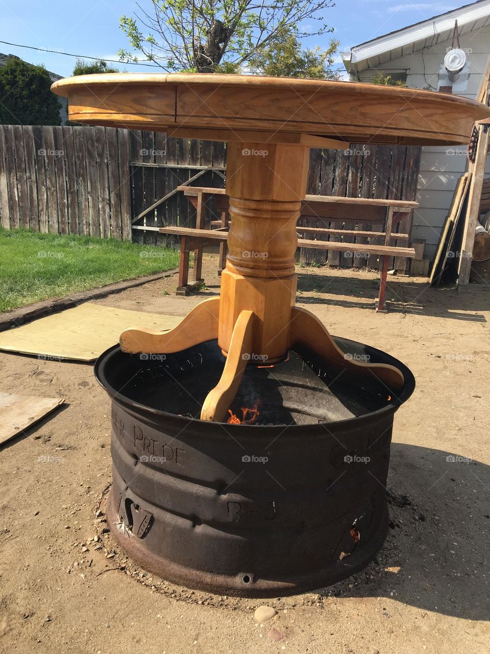 This is a good example of metal vs wood, we burned a wood table, on top of a metal firepit and guess who won, if you guessed the firepit, you are correct, and there is a wood picnic table in behind,wood fence, as well as plywood laying on the ground