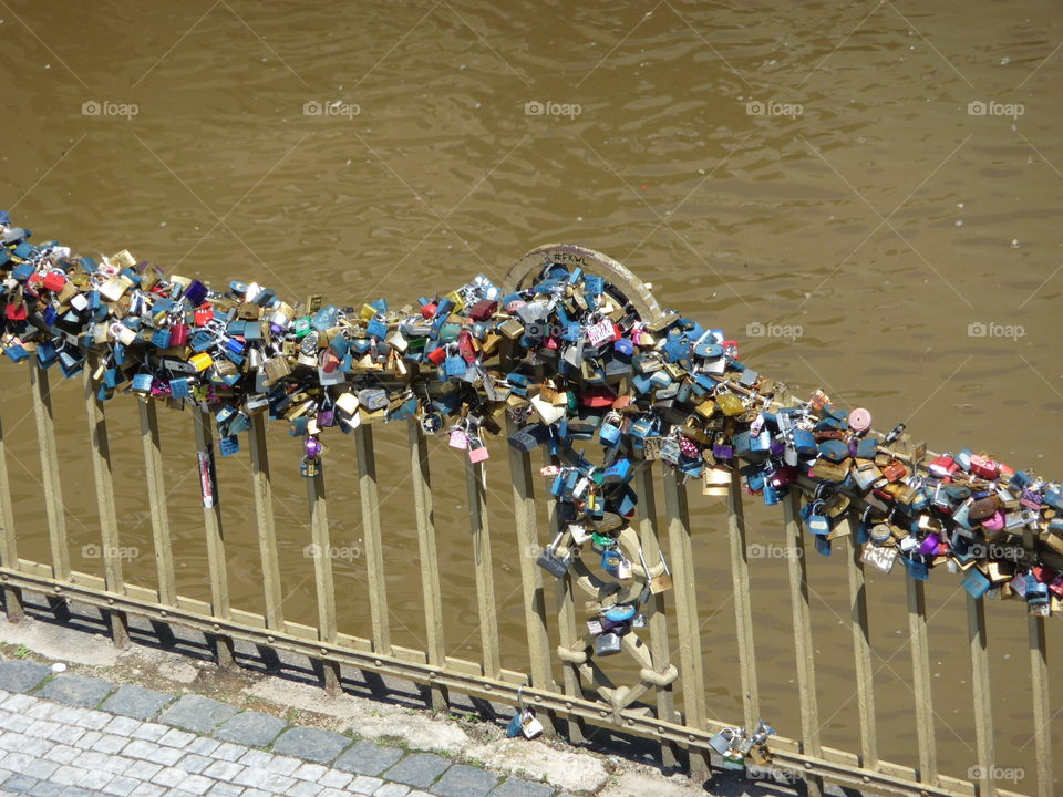 A million ways to say I Love You. Show your significant other how much you care and love him/her by fixing a lock to this small bridge in the old quarter of Prague. We did it - it's the red one in the middle.