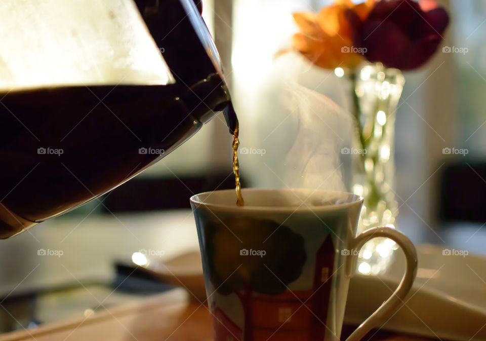 Tea pouring in the cup