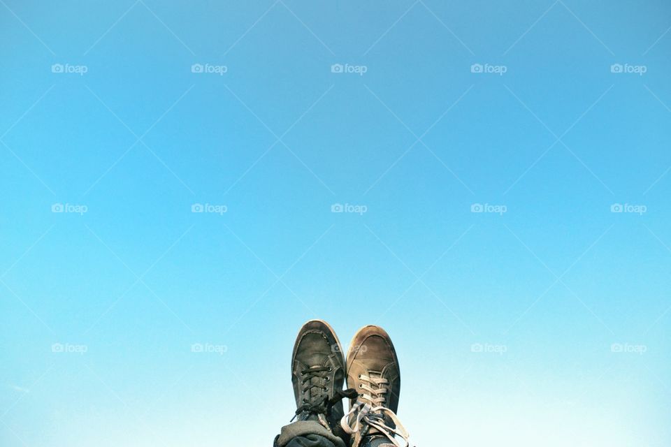 Por of shoes with a blue clean sky