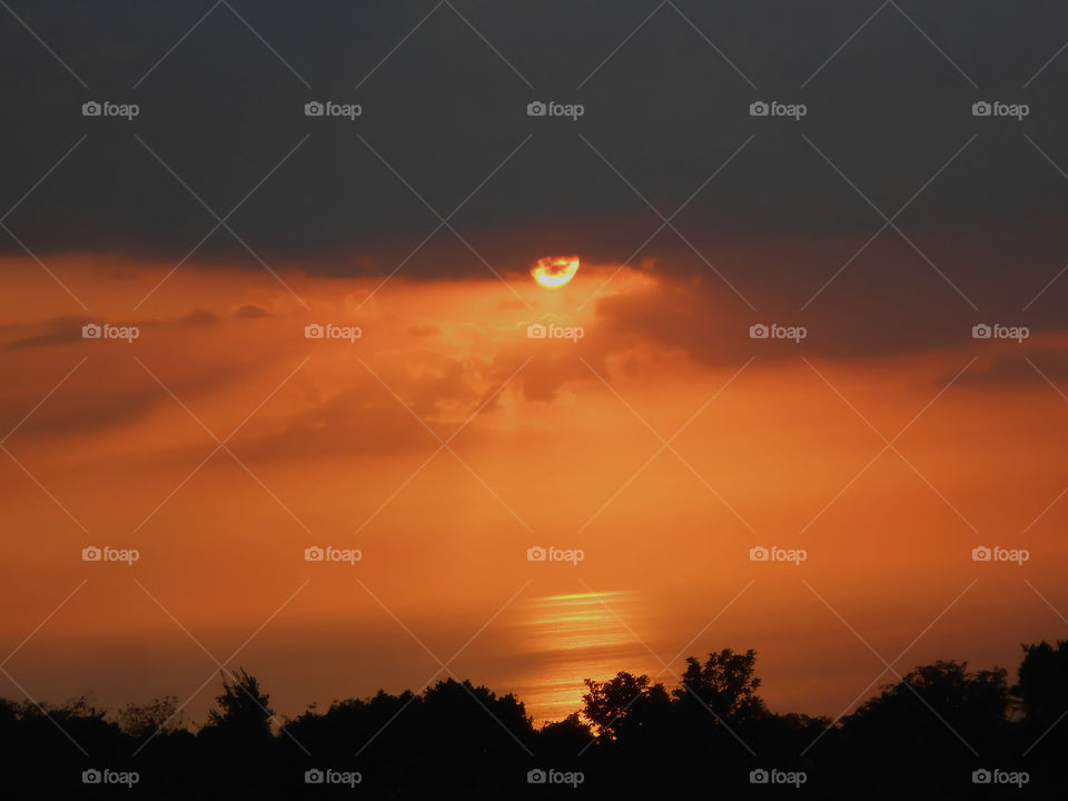 Beautiful Sunset Beneath Dark Clouds