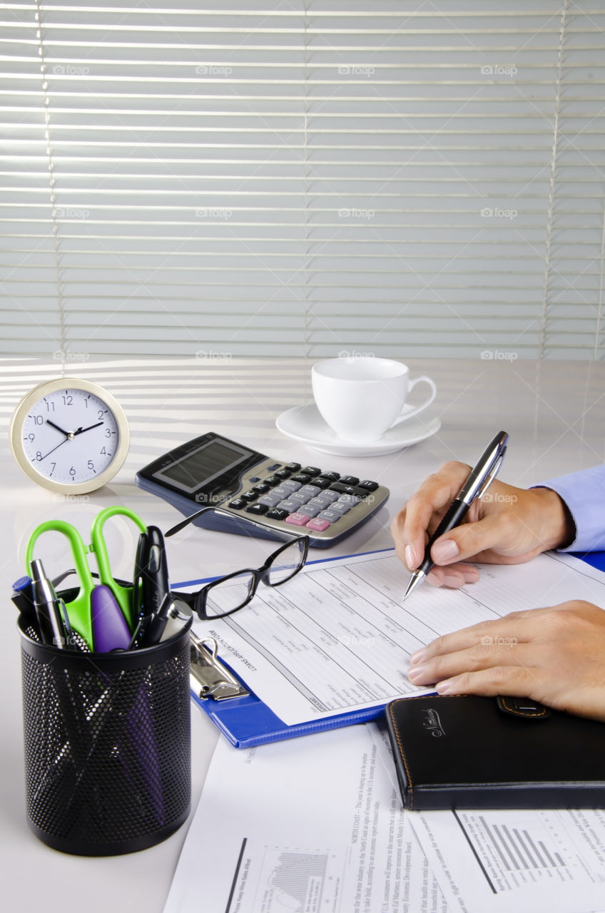 An accountant working in his office