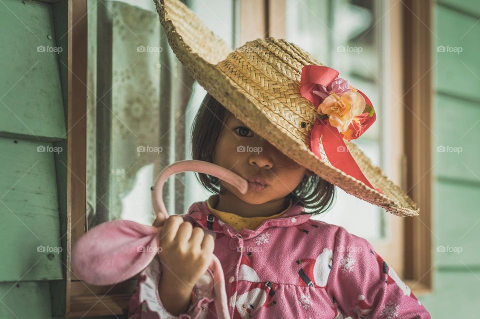 Portrait shot of a little girl making style statement
