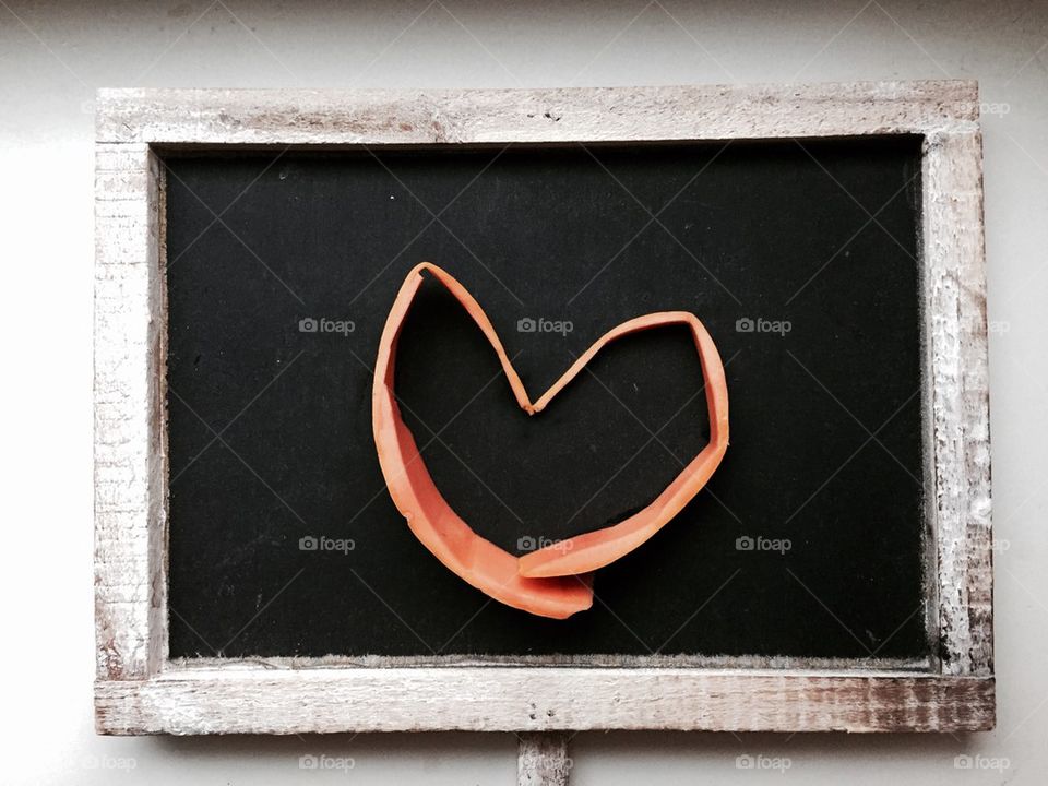 Heart Shaped papaya skin on chalk board