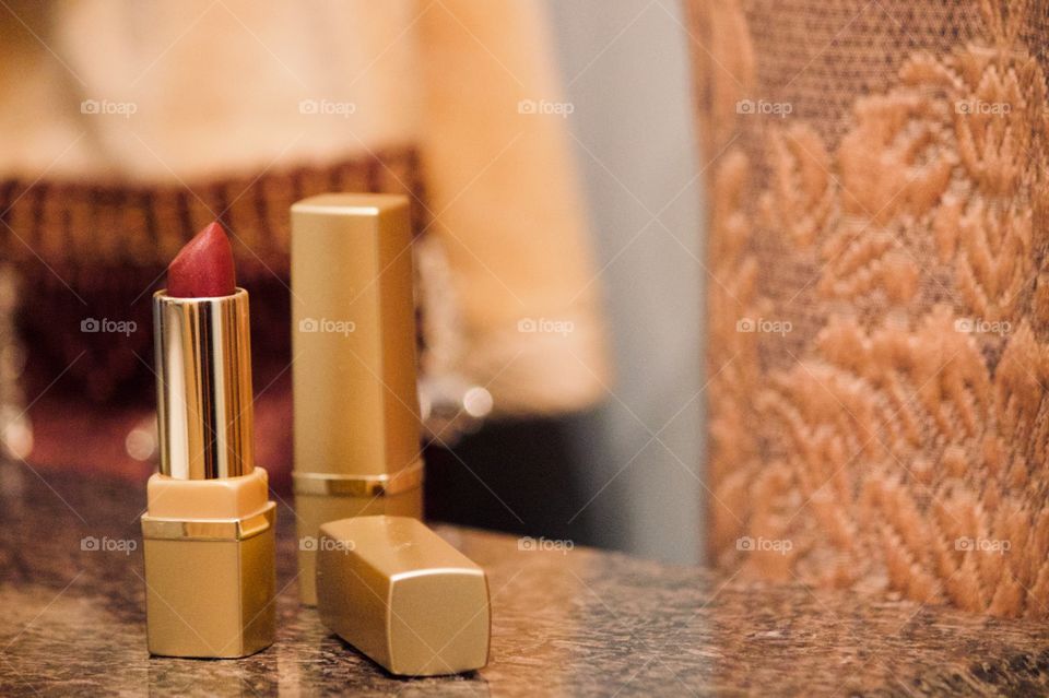 Golden lipstick in the bathroom 