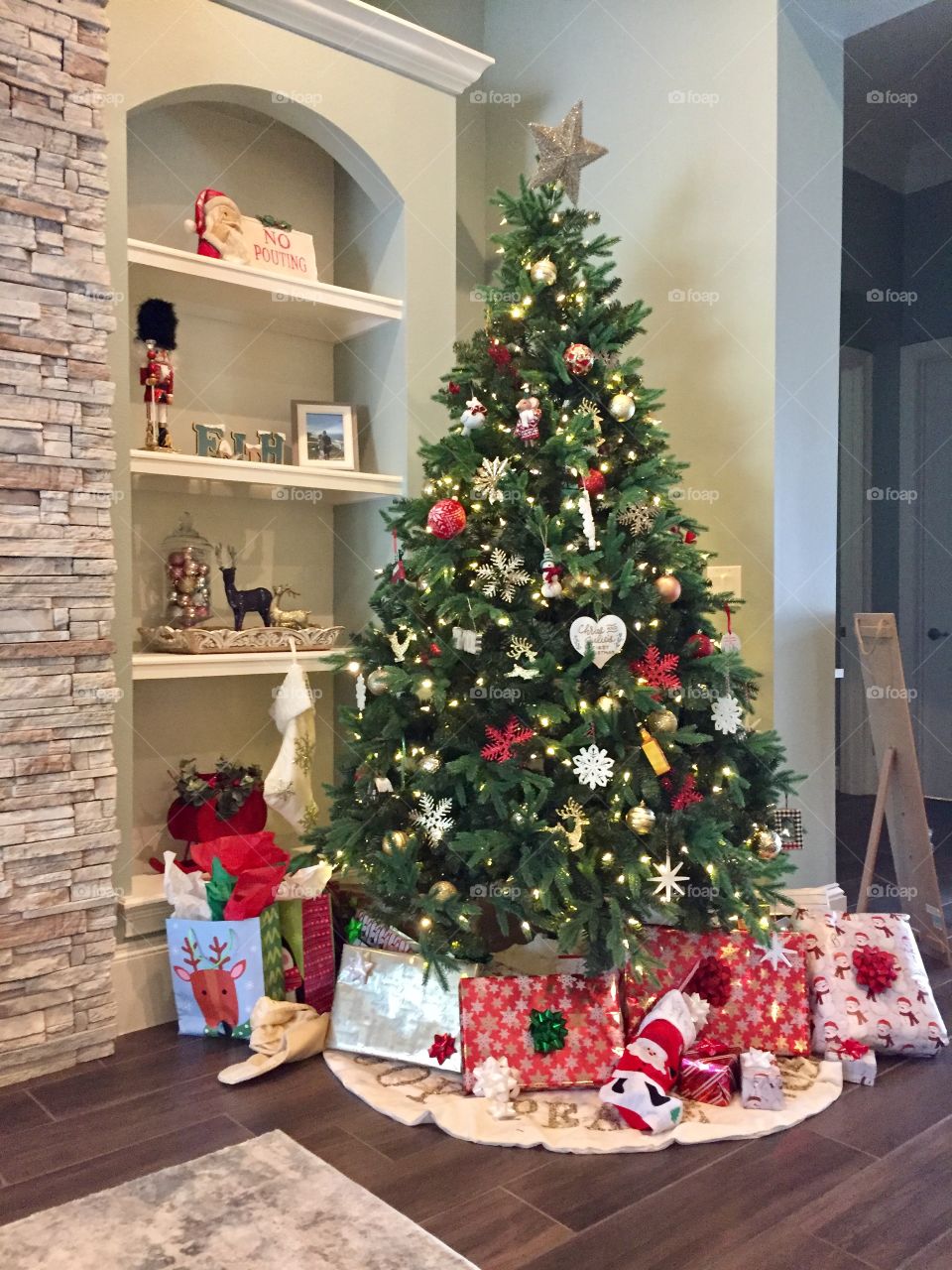 House decorated for Christmas with Christmas tree and presents ready to open.