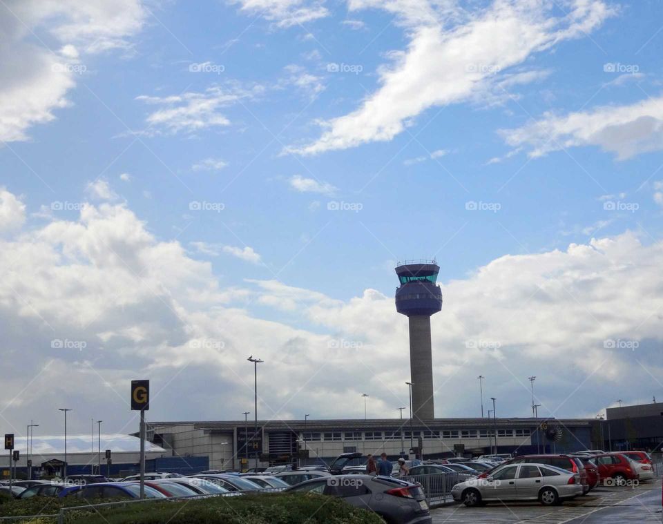 Parking at the airport with cloudy sky after rain