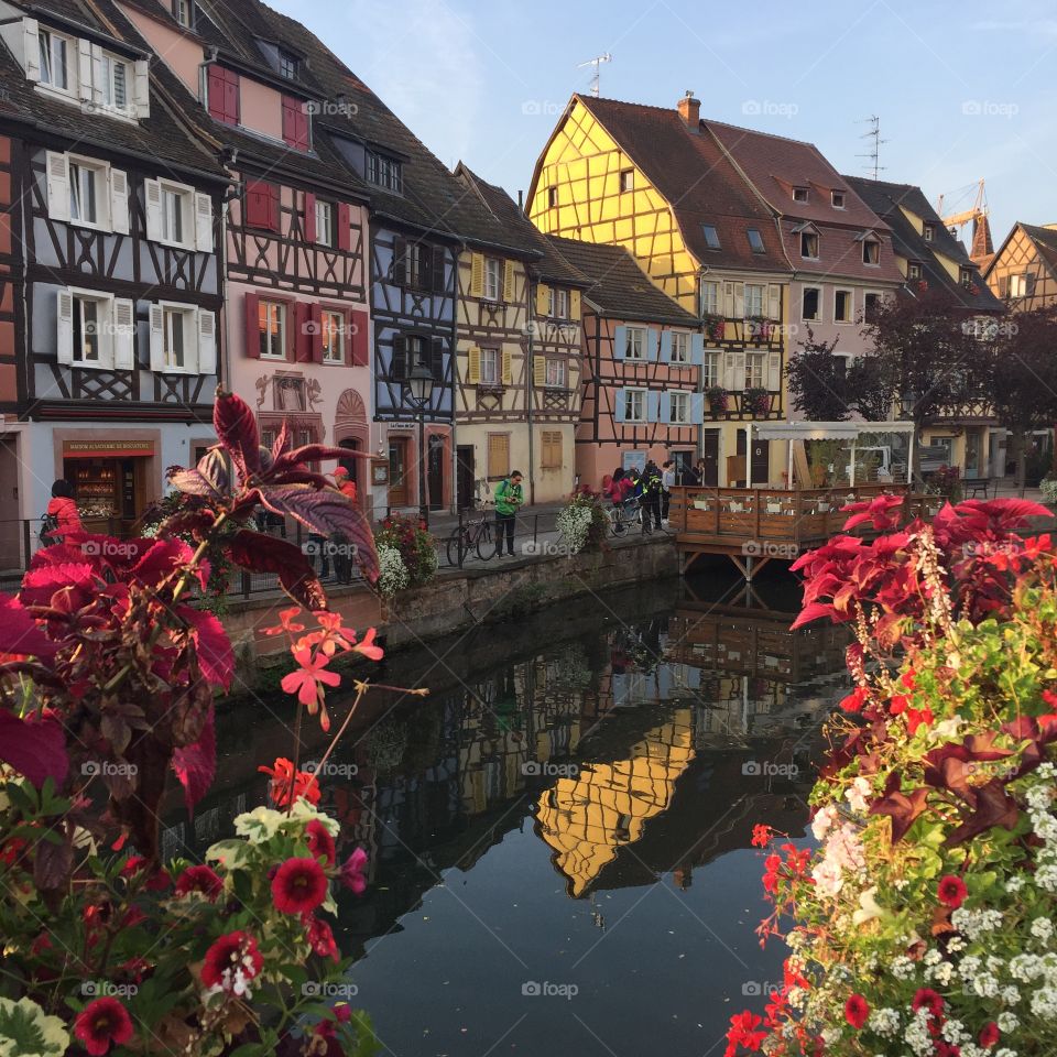The beautiful flower lined canals of Colmar, a medieval city in the French province of Alsace.