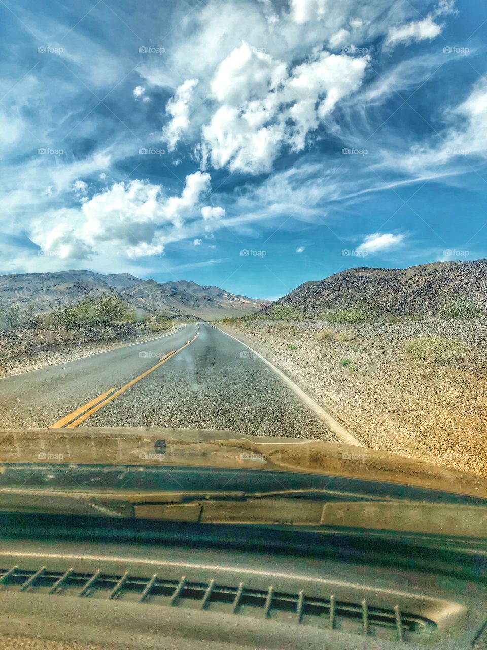 Empty road ahead for a road trip across the Nevada desert