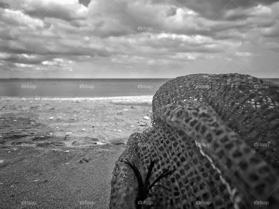 Net left on the beach on BW.
