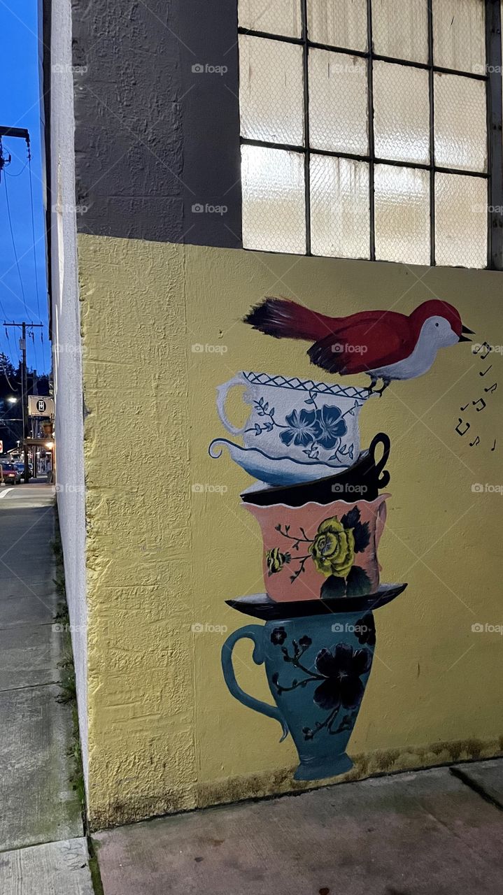 Street art with bird & teacups 