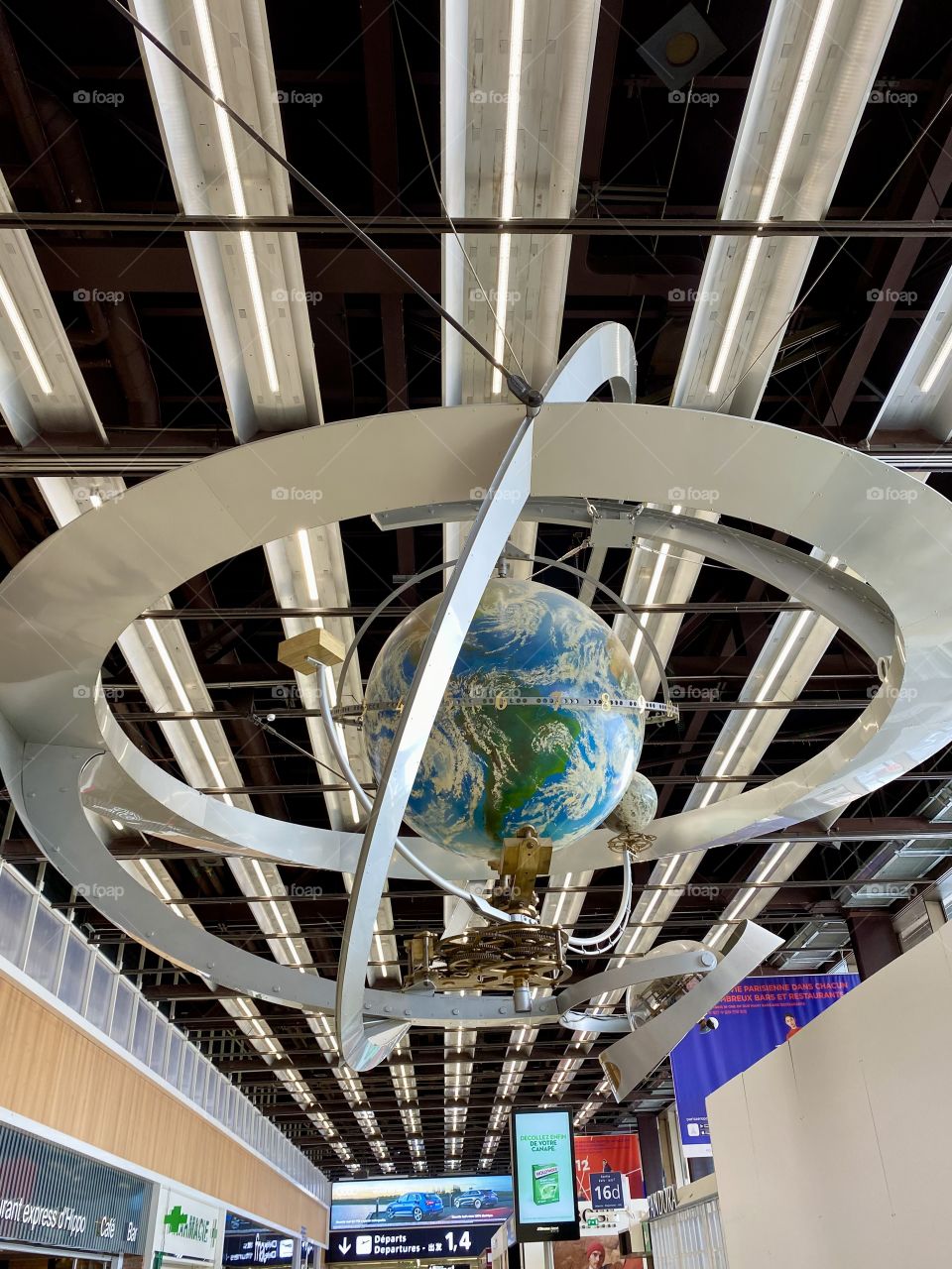 Earth globe with suspended metal structure at orly airport