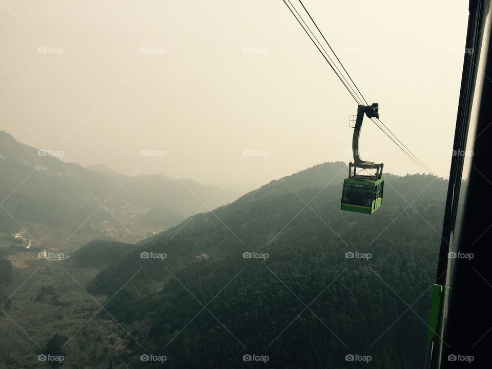 Descending Hengshan (original). A view of of a cable car coming up the mountain while descending Hengshan mountain, China. Original photo